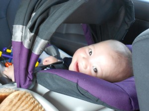 Harlan plays peek-a-boo in the Jeep.